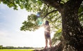 Alone woman stand under tree Royalty Free Stock Photo