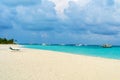 Lounge chairs on a beautiful tropical beach at Maldives