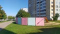 Along the city street are residential homes, trees and parked cars. Nearby is a paved driveway, sidewalk and lawns. The playground Royalty Free Stock Photo