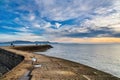 Dramatic Winter Sunrise over the Cobb Harbour Wall