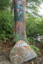 graffiti tree with rock and sign reading LOVE, spread love not hate Royalty Free Stock Photo