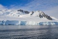 Alongside an Antarctic glacier and mountain range