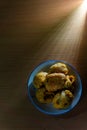 Aloo bonda in a plate on a wooden background