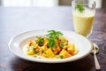 aloo gobi with a glass of mango lassi