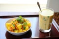 aloo gobi with a glass of mango lassi