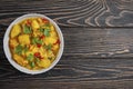 Aloo Gobi side dish. Traditional spicy vegetarian indian curry dish with potatoes, cauliflower, spinach with spices Royalty Free Stock Photo