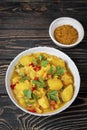 Aloo Gobi side dish. Traditional spicy vegetarian indian curry dish with potatoes, cauliflower, spinach with spices Royalty Free Stock Photo