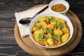 Aloo Gobi side dish. Traditional spicy vegetarian indian curry dish with potatoes, cauliflower, spinach with spices Royalty Free Stock Photo