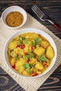 Aloo Gobi side dish. Traditional spicy vegetarian indian curry dish with potatoes, cauliflower, spinach with spices Royalty Free Stock Photo