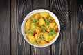 Aloo Gobi side dish. Traditional spicy vegetarian indian curry dish with potatoes, cauliflower, spinach with spices Royalty Free Stock Photo