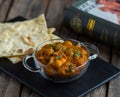 aloo nakhi or aloo karahi with bread served in a dish isolated on cutting board side view of breakfast on wooden background Royalty Free Stock Photo