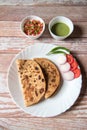 Aloo paratha or mashed potato served with condiments and curd. Royalty Free Stock Photo