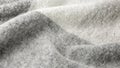 Alpaca wool mix soft warm scarf, pattern background. Trendy cream grey color wool texture
