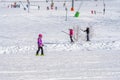 ALPE D'HUEZ, FRANCE - 31.12.2021:Girl skiing in the Alpine mountains with white snow and blue sky. People Skier