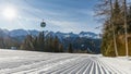 Dolomites, ski area with beautiful slopes and blue sky. Empty ski slope in winter on a sunny day. Prepare ski slope, Alpe di Lusia Royalty Free Stock Photo