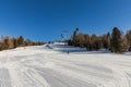 Dolomites, ski area with beautiful slopes and blue sky. Empty ski slope in winter on a sunny day. Prepare ski slope, Alpe di Lusia Royalty Free Stock Photo
