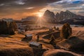 Alpe di Siusi, Italy - Aerial panoramic view of wooden cottages at Seiser Alm, a Dolomite plateau in South Tyrol in the Dolomites