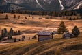 Alpe di Siusi, Italy - Traditional wooden chalets at Seiser Alm, an alpine meadow at autumn morning at the Italian Dolomites