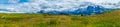 Alpe di Siusi, Seiser Alm with Sassolungo Langkofel Dolomite, a large green field with a mountain in the background panorama Royalty Free Stock Photo