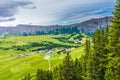 Alpe di Siusi, Seiser Alm with Sassolungo Langkofel Dolomite, lush green field in Seiser Alm Puflatsch Bullaccia