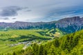 Alpe di Siusi, Seiser Alm with Sassolungo Langkofel Dolomite, lush green field in Seiser Alm Puflatsch Bullaccia