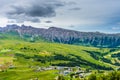 Alpe di Siusi, Seiser Alm with Sassolungo Langkofel Dolomite, lush green field in Seiser Alm Puflatsch Bullaccia