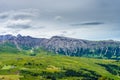 Alpe di Siusi, Seiser Alm with Sassolungo Langkofel Dolomite, lush green field in Seiser Alm Puflatsch Bullaccia Royalty Free Stock Photo