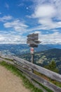 Alpe di Siusi, Signpost with trek sign to Puflatsch bullacia baita arnika bull and pufels