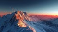 Alpenglow on snowcapped peaks in ultra realistic high res shot with deep blue sky