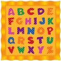 Alphabet baby quilt, bright polka dot letters, gold background