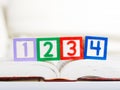 Alphabet block with 1234 on book Royalty Free Stock Photo
