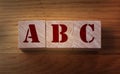 Alphabet blocks ABC on wooden background. Elementary School education concept Royalty Free Stock Photo