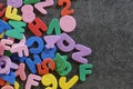 Alphabet kids cutout letters on black background