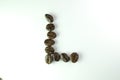 Alphabet L form Coffee beans in white background Royalty Free Stock Photo