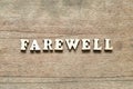 Alphabet letter in word farewell on wood background Royalty Free Stock Photo