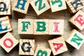 Alphabet block in word FBI Abbreviation of Federal Bureau of Investigation with another on wood background Royalty Free Stock Photo