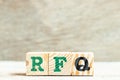 Alphabet letter in word RFQ abbreviation of request for quotation on wood background