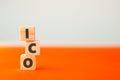 Alphabet letter on wooden cube blocks. Initial public offering ICO crypto currency concept