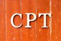 Alphabet in word  CPT Abbreviation of Carriage Paid To on old red color wood plate background Royalty Free Stock Photo