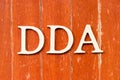 Alphabet in word DDA Abbreviation of Depreciation, depletion and amortization or demand deposit account on old red color