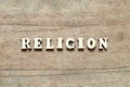 Alphabet letter in word religion on wood background Royalty Free Stock Photo