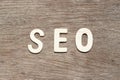 Alphabet in word SEO Abbreviation of search engine optimization on wood background Royalty Free Stock Photo