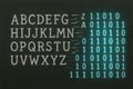 Alphabet letters and binary code on chalkboard background, concept of digital language, encoding and encryption Royalty Free Stock Photo