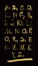 Alphabet letters lowercase, uppercase and numbers gold on black. Royalty Free Stock Photo