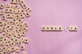 Dyslexia concept - alphabet letters on pink background
