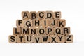 Alphabet letters on wooden cubes, isolated on white Royalty Free Stock Photo