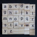 Alphabet letters on wooden scrabble pieces Royalty Free Stock Photo