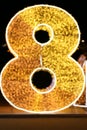 Alphabet Number Eight Gold, Blurred Bokeh letter eight 8 gold font type colorful lighting Glittering shine yellow on night black