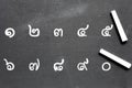 alphabet number 1 to 0 handwritten in white chalk. Hand written thailand numbers math and two chalk sticks. Royalty Free Stock Photo