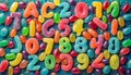 Alphabet with numbers, made with photo of brightly coloured jelly bean sweets as the background Royalty Free Stock Photo